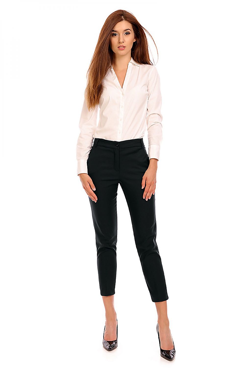Woman wearing Plus Size Marvielle High-Waist 7/8 Trousers in black, tailored fit, with button and zip fly, paired with a white blouse.