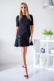 Woman wearing Plus Size Selvianne Frill Hem Dress with elbow-length sleeves and frilled hem, perfect for formal or daytime events.