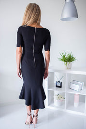 Plus Size Rivoria Zipped Cocktail Dress with frill, elegant elbow-length sleeves, and decorative back zipper, perfect for formal events.
