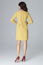 Back view of woman wearing Virette Fitted V-Slit Daydress with 3/4 sleeves, showcasing elegant silhouette in yellow, paired with red heels.