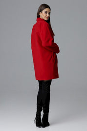 Model wearing red Calverra loose-fit coat with kimono sleeves, highlighting double-breasted design and elegant silhouette.