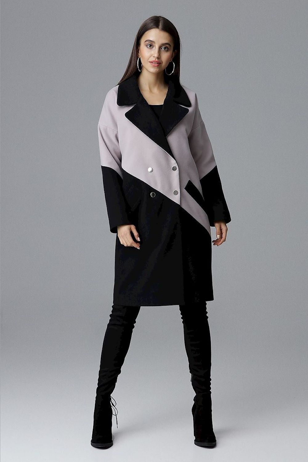 Model wearing Ornavine two-tone coat with turn-up collar and silver snap fasteners, showcasing elegance and modern style.