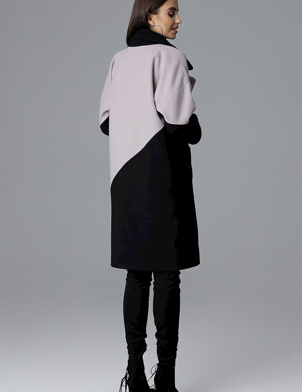 Back view of a woman wearing the Ornavine Two-Tone Coat with Turn-Up Collar, featuring elegant silver-colored snap fasteners.