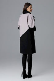 Back view of a woman wearing the Ornavine Two-Tone Coat with Turn-Up Collar, featuring elegant silver-colored snap fasteners.