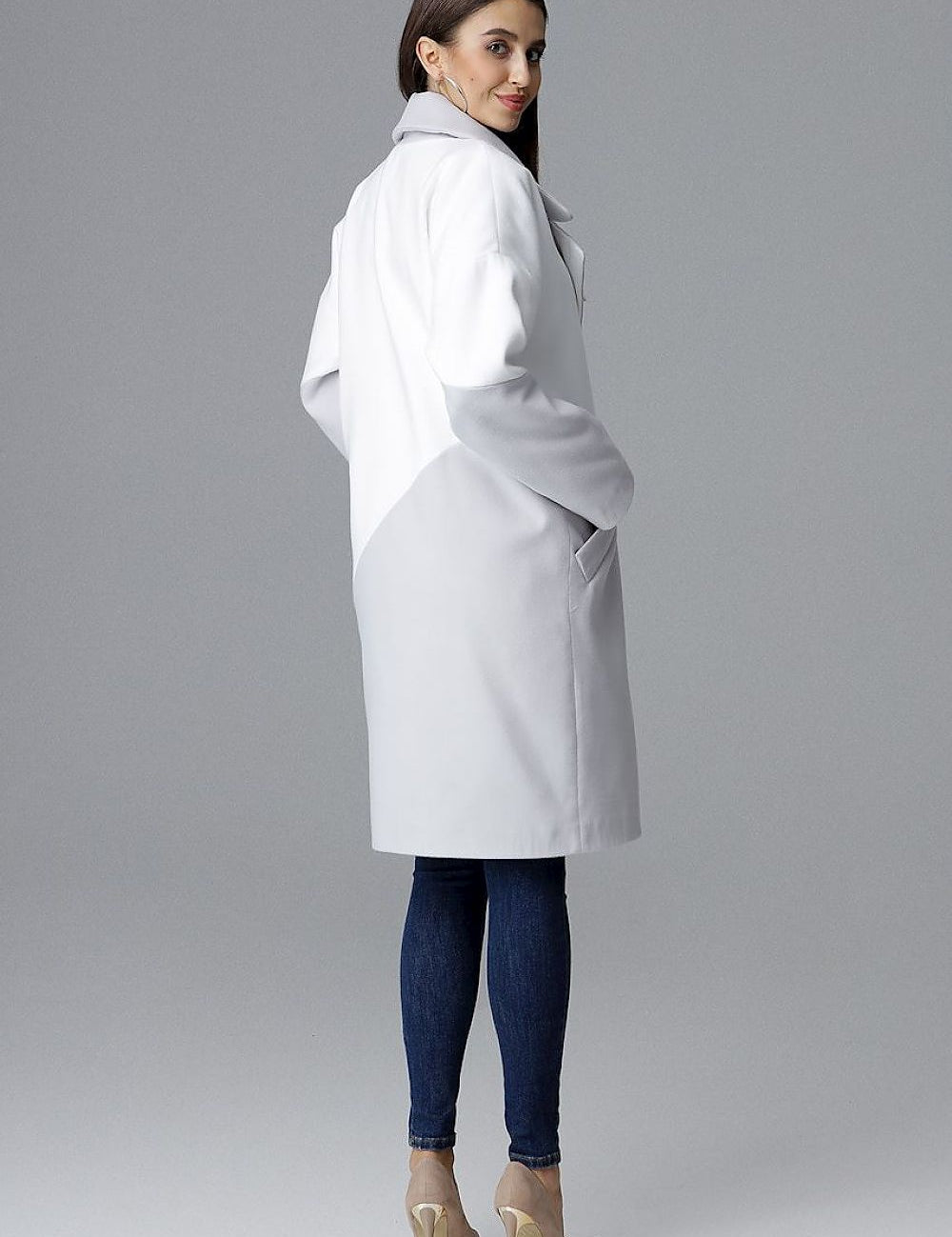 Woman wearing Ornavine two-tone coat with turn-up collar, showcasing style and comfort.