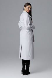 Woman modeling Melvarine Long Single-Breasted Belted Coat with back slit and timeless silhouette for modern style.