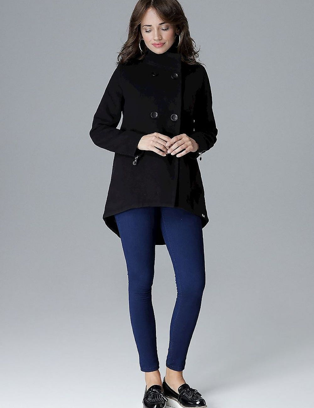 Woman wearing Arvennise stand-collar jacket with zipper details and button placket, styled casually with blue leggings.