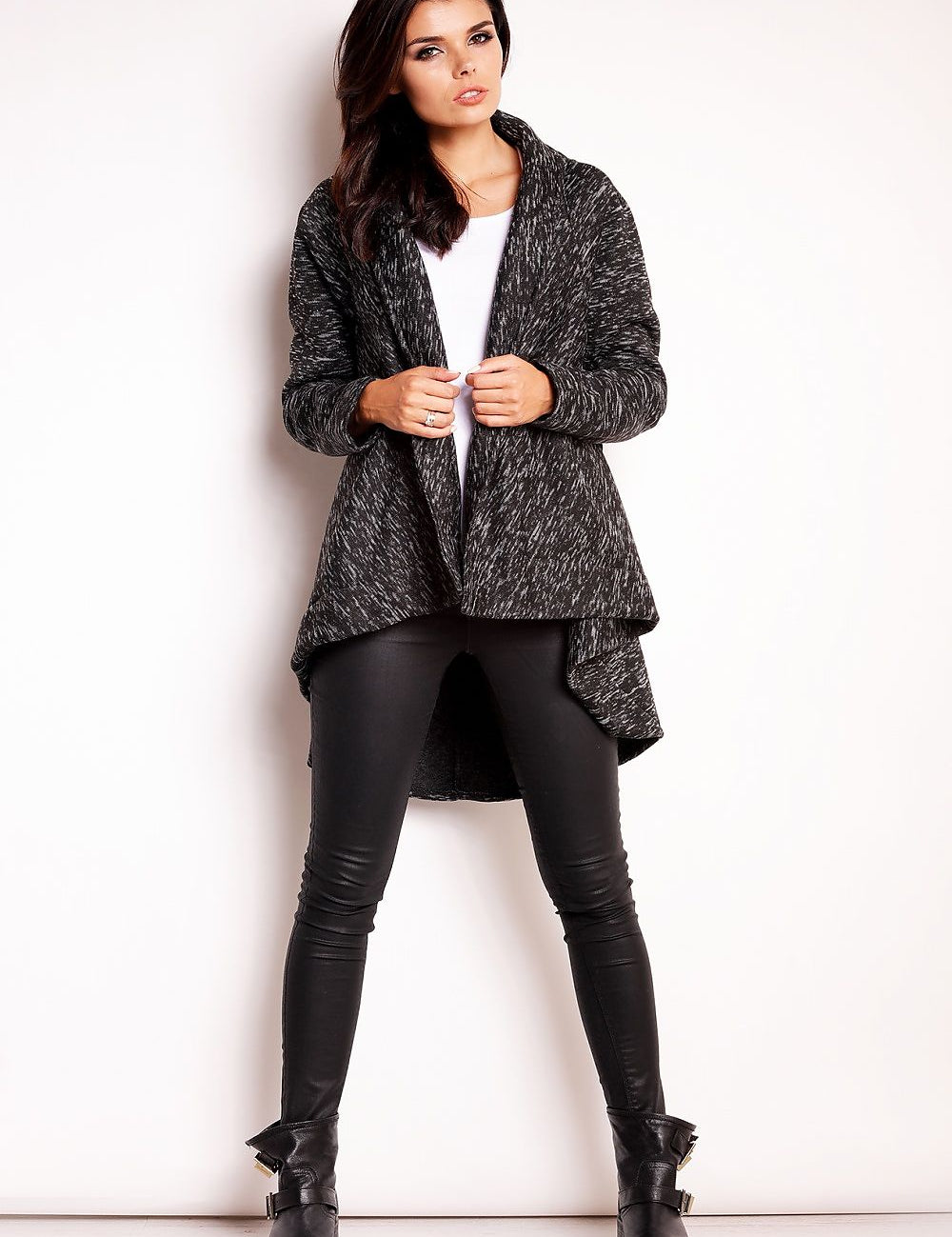 Model wearing Elvathine loose-fit coat with extended back in dark gray, paired with black leggings and boots, showcasing casual style.