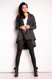 Model wearing Elvathine loose-fit coat with extended back in dark gray, paired with black leggings and boots, showcasing casual style.