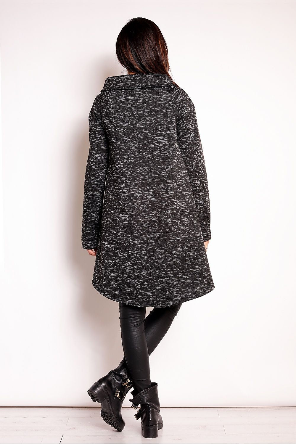 Back view of a woman wearing the Elvathine Loose-Fit Coat with an extended back hem, showcasing the coat's modern and relaxed silhouette.