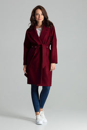 Carivelle maroon belted coat with wide lapels, featuring a polished look with metal eyelets, worn by a model against a gray background.