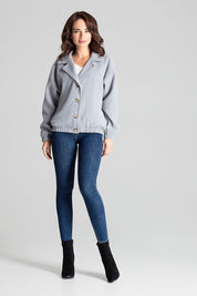 Model wearing Cerythra short grey loose-fit jacket with decorative buttons, dropped sleeves, and elasticated cuffs, styled casually.