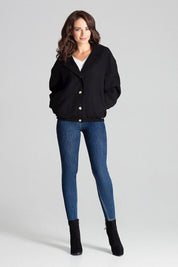 Woman wearing Cerythra Short Grey Loose-Fit Jacket with buttons, styled casually with denim jeans and black boots.