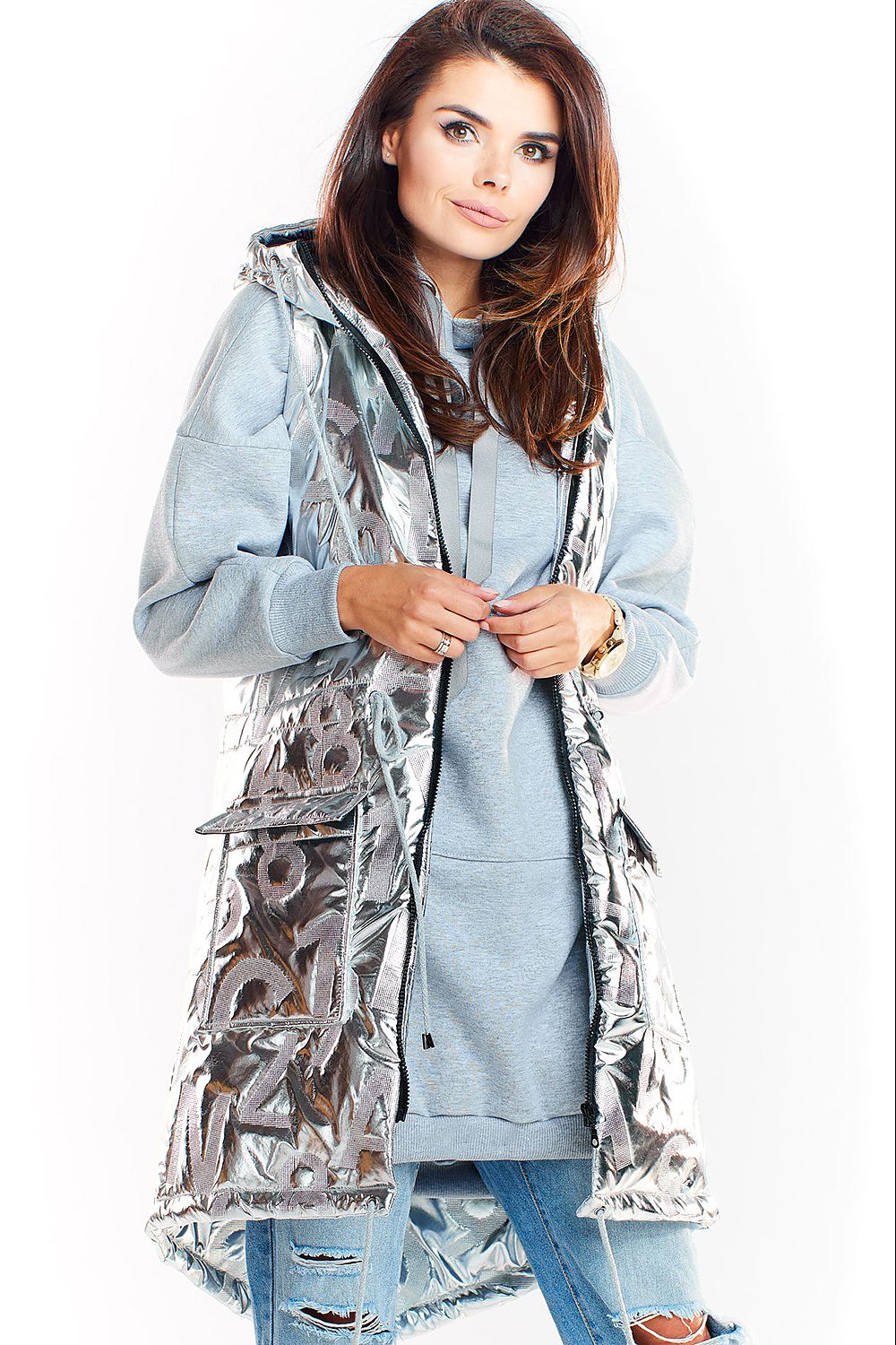 Woman wearing Orlavine Shiny Quilted Hooded Gilet Vest in black and silver with side pockets, perfect for autumn layering.