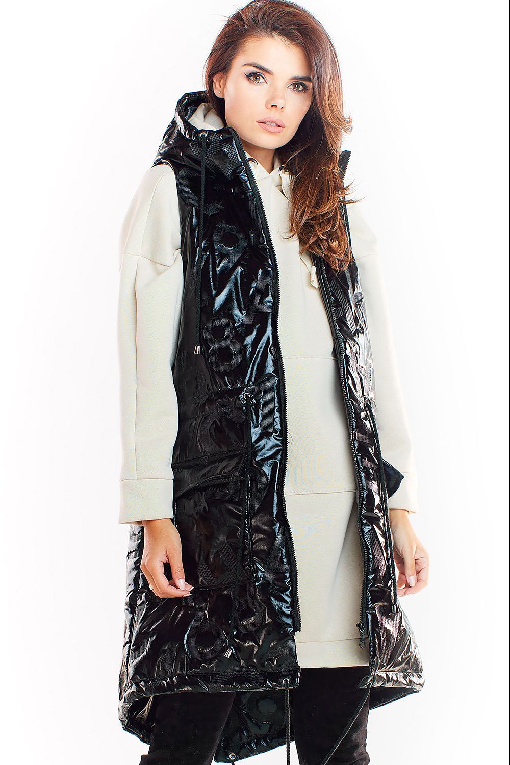 Woman wearing Orlavine Shiny Quilted Hooded Gilet Vest in black and silver tones with hood and pockets