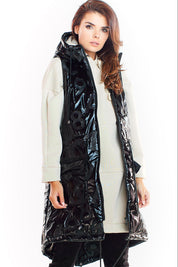 Woman wearing Orlavine Shiny Quilted Hooded Gilet Vest in black and silver tones with hood and pockets