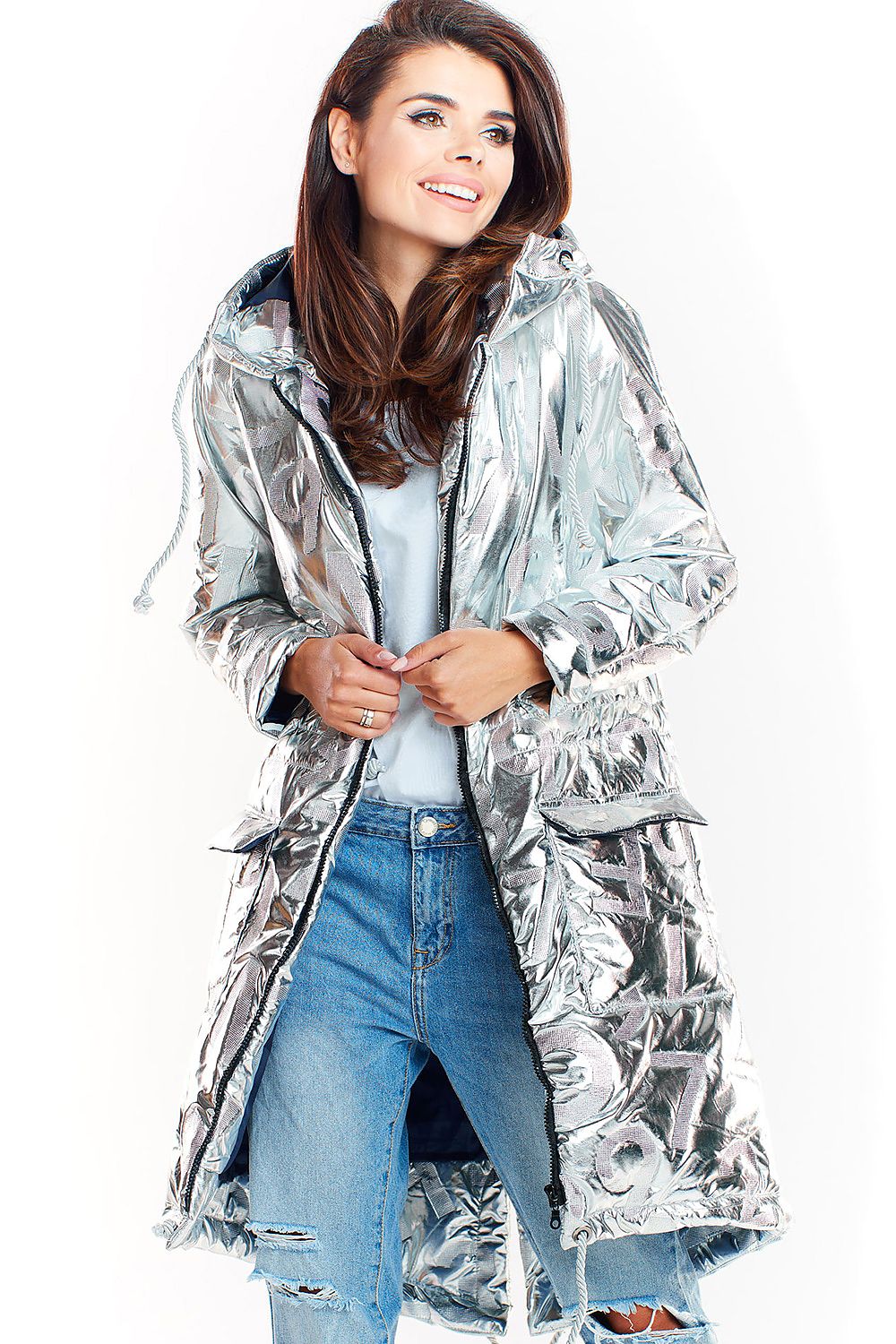 Woman wearing Morvanna silver oversized glossy insulated coat with jeans, showcasing urban style and warmth.