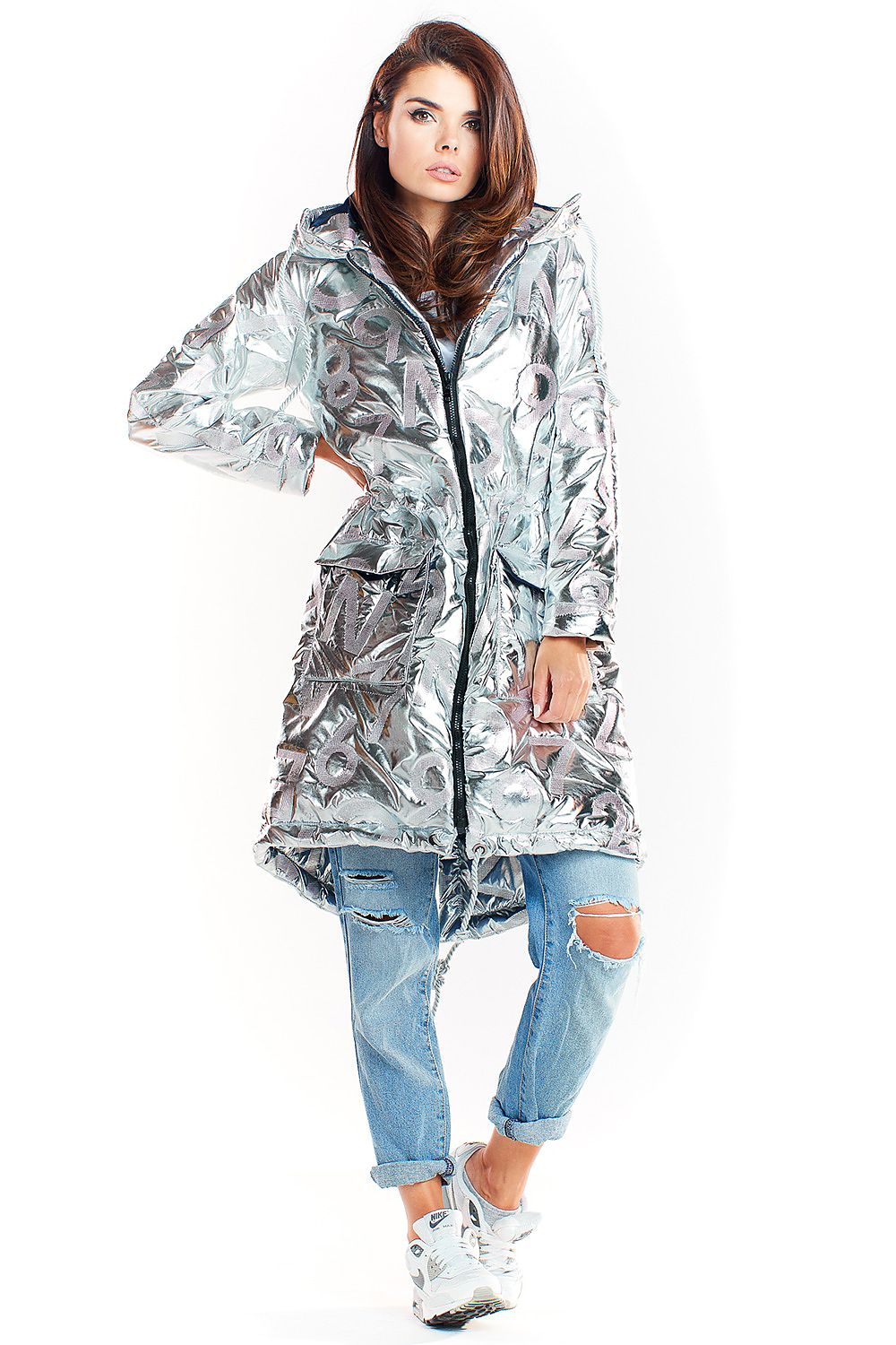 Model wearing Morvanna Oversized Glossy Insulated Coat in silver, styled with ripped jeans and sneakers, showcasing urban chic fashion.