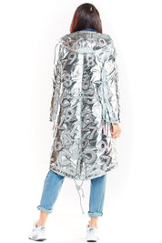 Woman wearing Morvanna Oversized Glossy Insulated Silver Coat with jeans and sneakers, showcasing the back design and length.