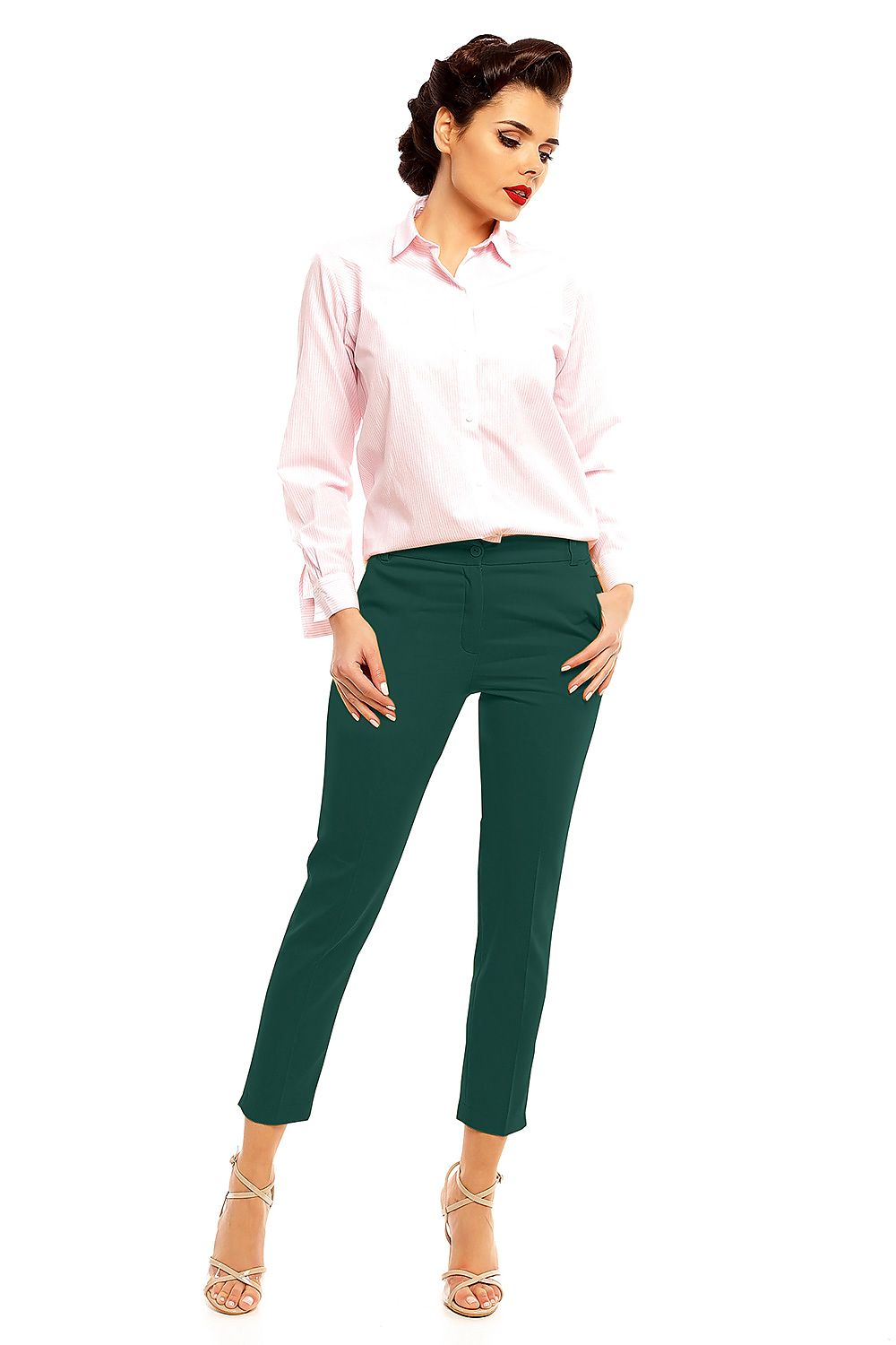 Model wearing Plus Size Marvielle High-Waist 7/8 Trousers in green, styled with a pink blouse, highlighting the tailored fit and elegance.