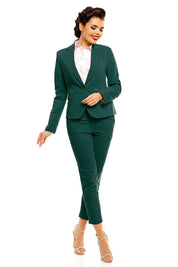 Woman wearing plus size Marvielle high-waist 7/8 trousers in green, styled with a tailored jacket and heels.