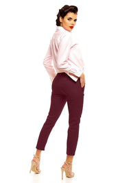 Woman wearing Plus Size Marvielle High-Waist 7/8 Trousers with tailored cut, high-rise waist, and side pockets in elegant style.