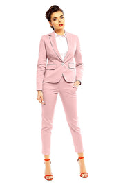 Model wearing pink Plus Size Marvielle High-Waist 7/8 Trousers with matching blazer and orange heels, showcasing elegant chic style.