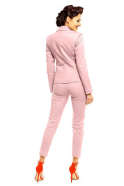 Back view of woman wearing pink plus size Marvielle high-waist 7/8 trousers with matching blazer and red high heels.