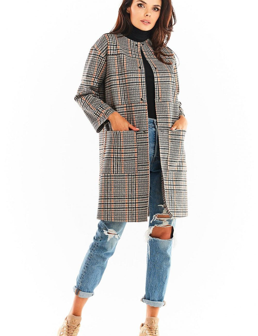 Woman wearing Calverisse Checked Straight-Cut Coat, no collar, navy blue and brown check pattern, with ripped jeans and boots.