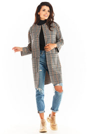 Woman wearing Calverisse Checked Straight-Cut Coat, collarless design, plaid pattern, paired with jeans and sneakers for a casual look.