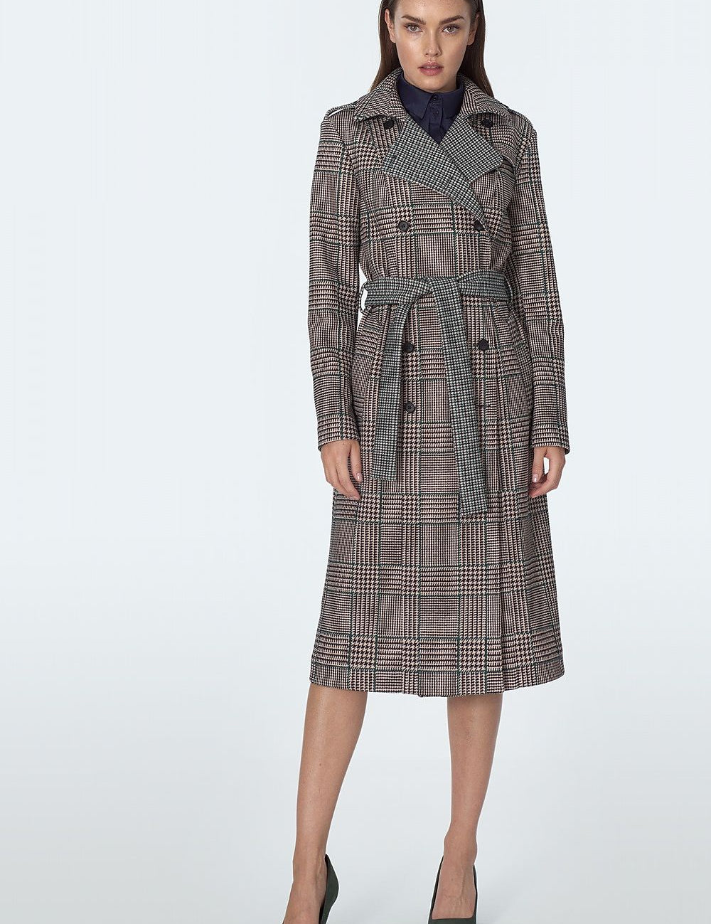 Model wearing Eryndale waist-defining checked coat, elegant tailored design, ideal for autumn and winter, versatile styling options.