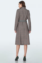 Back view of a woman wearing the Eryndale Checked Waist-Defining Coat, showcasing its elegant tailored cut and check pattern.