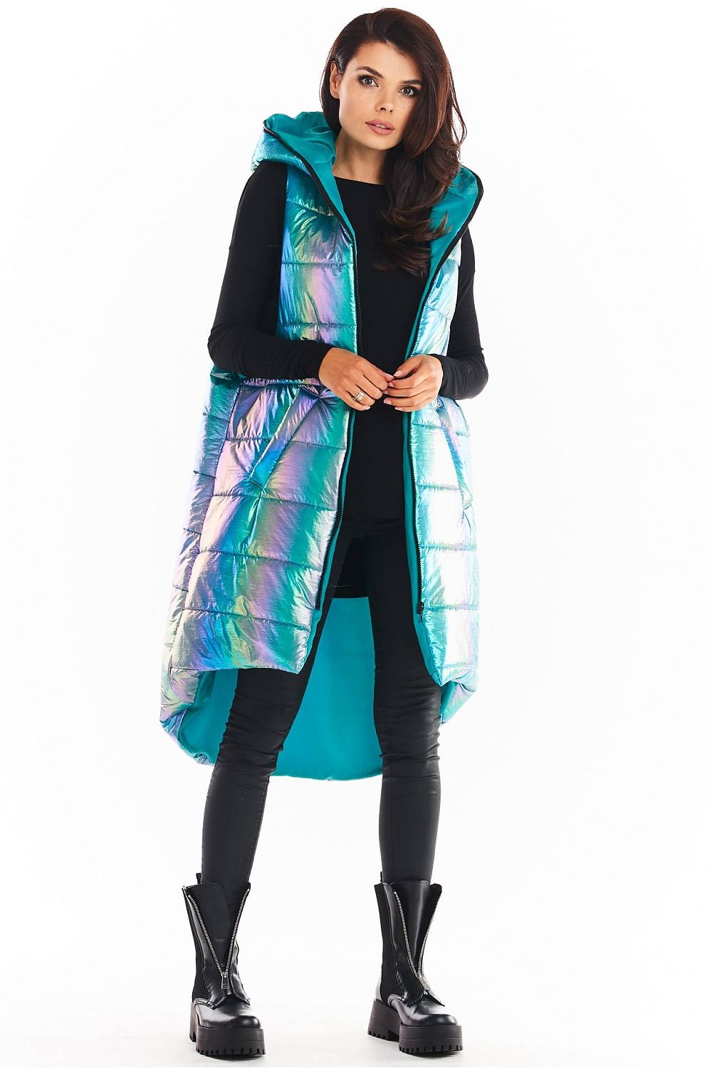 Woman wearing Lumarelle holographic hooded gilet vest with shimmering finish, large hood, and dynamic silhouette in mint color.