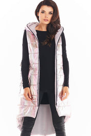 Lumarelle Holographic Hooded Gilet Vest in pink with shimmering finish, extended back, and spacious front pockets, worn over black outfit.