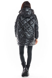 Back view of Amawa oversized quilted hooded jacket in black, featuring large hood and quilted design, showcasing modern casual style.