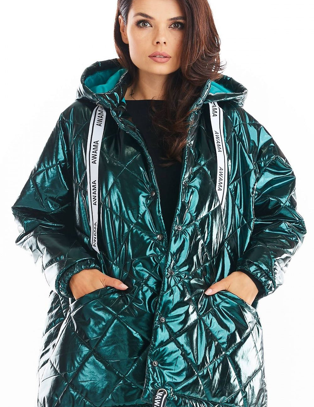 Amawa oversized quilted hooded jacket with decorative logo tape, featuring front pockets and snap fastening, worn by a model.