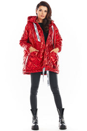 Red Amawa Oversized Quilted Hooded Jacket with logo tape, snap fastening, and front pockets, blending comfort and modern style.