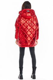 Back view of a red Amawa oversized quilted hooded jacket with decorative logo tape, worn over black pants and boots.