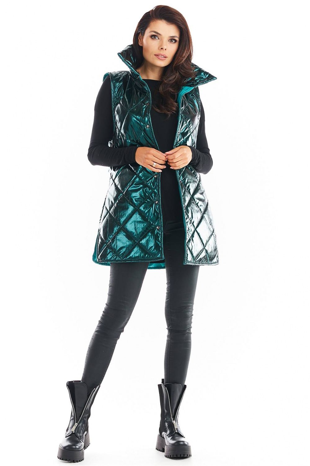Woman wearing Clarewyn quilted high-collar gilet vest, styled with black pants and boots, showcasing a versatile autumn outerwear look.