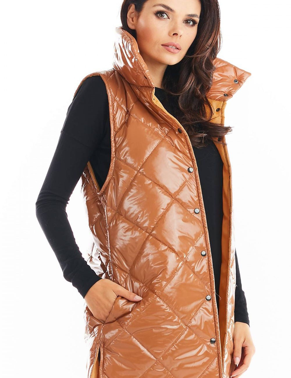 Woman wearing Clarewyn Quilted High-Collar Gilet Vest in glossy brown, featuring tall collar and button closure, for autumn layering.