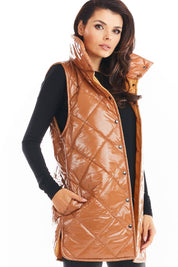 Woman wearing Clarewyn Quilted High-Collar Gilet Vest in glossy brown, featuring tall collar and button closure, for autumn layering.