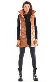 Woman wearing Clarewyn Quilted High-Collar Gilet Vest in brown with front button closure and tall collar, styled for fall fashion.