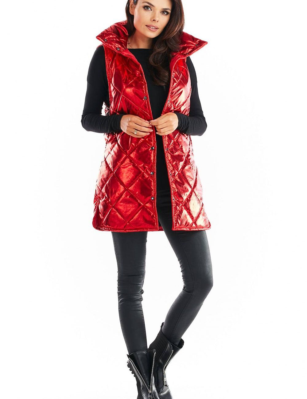 Woman wearing red Clarewyn quilted high-collar gilet vest, styled for autumn layering with black outfit and boots.