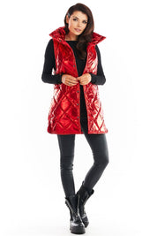 Woman wearing red Clarewyn quilted high-collar gilet vest, styled for autumn layering with black outfit and boots.