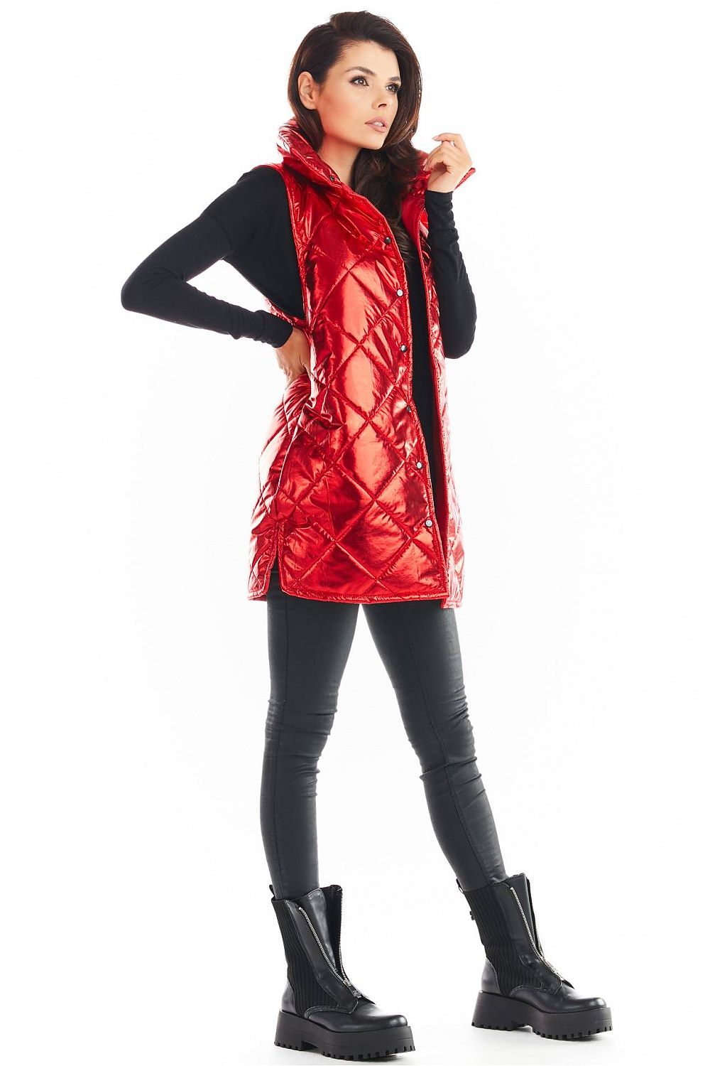 Model wearing red Clarewyn Quilted High-Collar Gilet Vest, featuring tall collar and front button closure, styled with black outfit and boots.