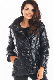 Woman wearing black Zavielle quilted jacket with stand collar, front buttons, and side pockets for warmth and style.