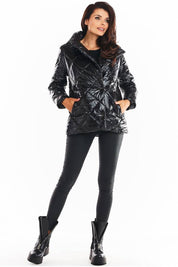 Zavielle Quilted Jacket with Stand Collar in black, featuring front buttons and pockets, shown on a model with a chic winter look.