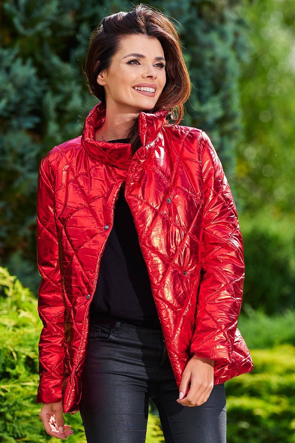Woman wearing red Zavielle Quilted Jacket with stand collar, featuring front buttons and spacious pockets for versatile warmth and comfort.