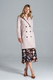 Stylish woman wearing Loryndra belted knee-length autumn coat with six-button front, showcasing timeless tailoring and everyday comfort.