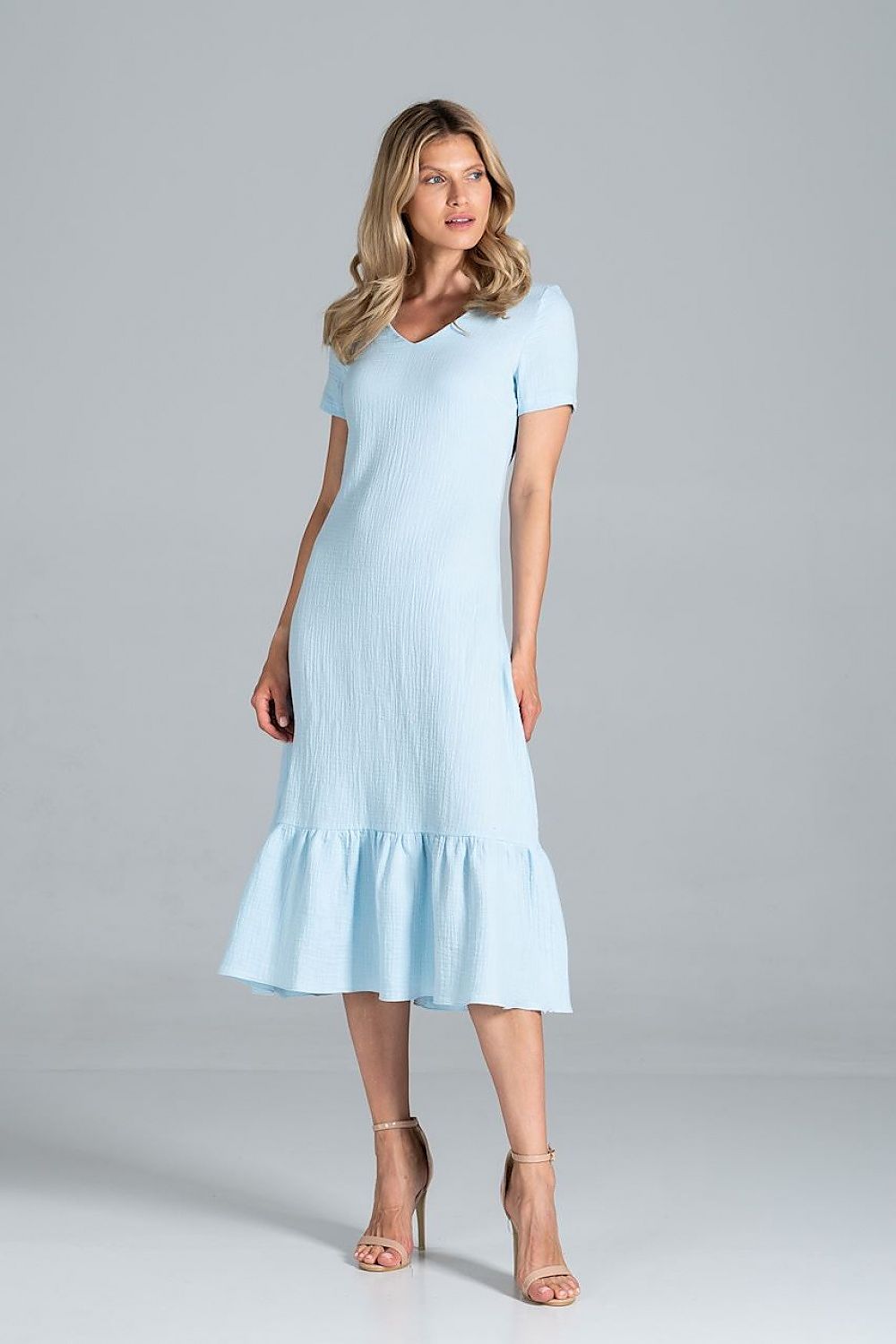 Light blue Elisara Flared Midi Dress with sweetheart neckline and short sleeves, showcasing an elegant style on a female model.